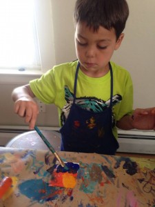 Young artist working on his impressionistic painting during our first Summer Art Camp of 2014!